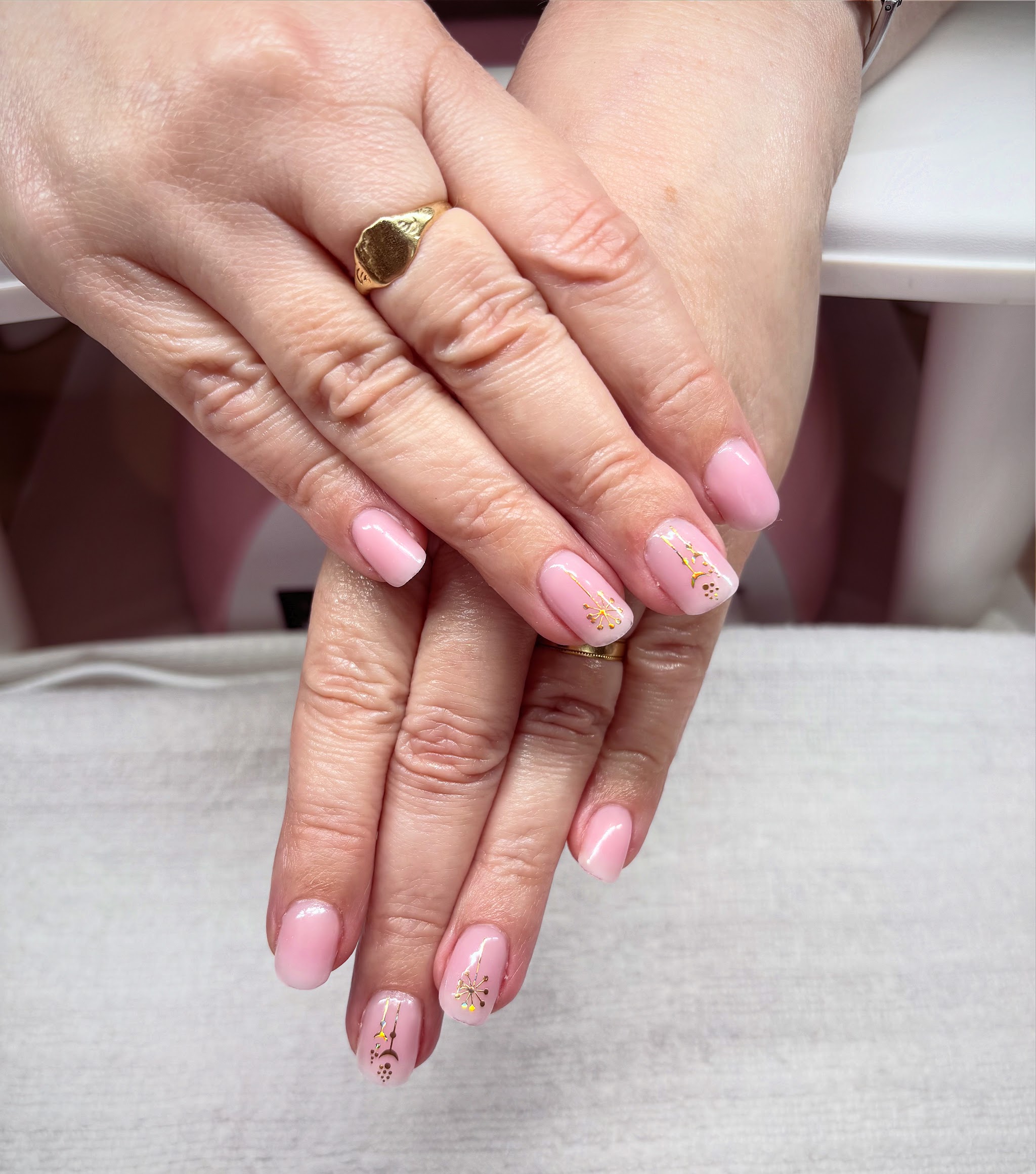 Soft pink nails with fine gold line art